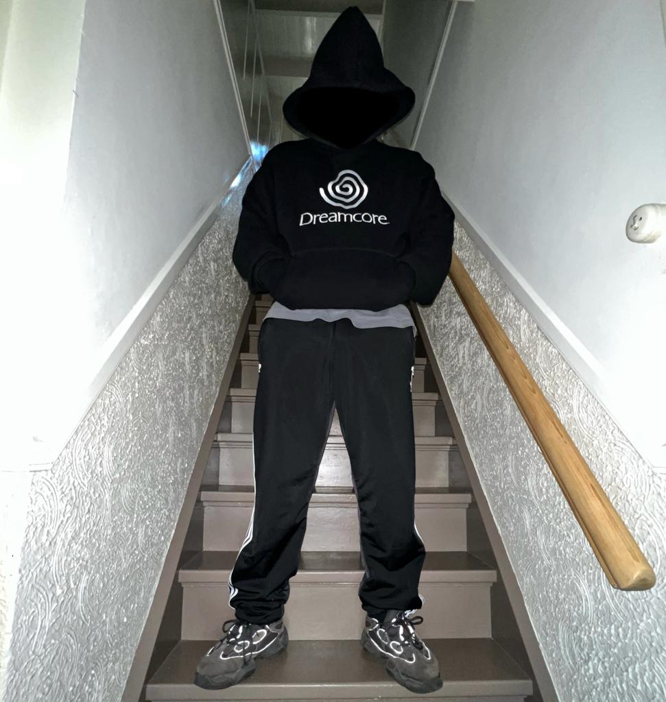 Oversized Dreamcore hoodie with embroidered design, blending weirdcore, nostalgiacore, and surreal nostalgic aesthetics inspired by late '90s visuals.